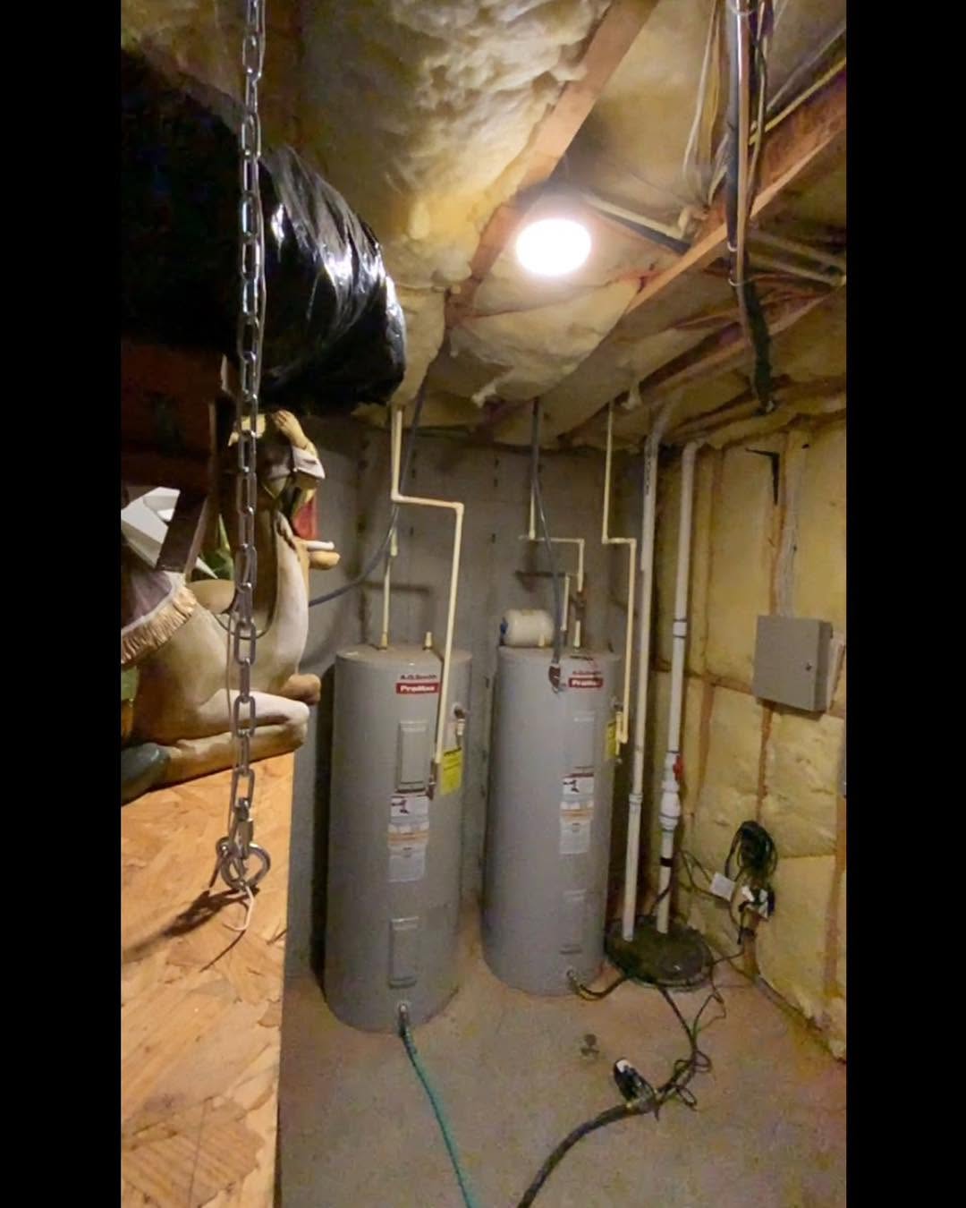 Two tank water heaters installed in a basement