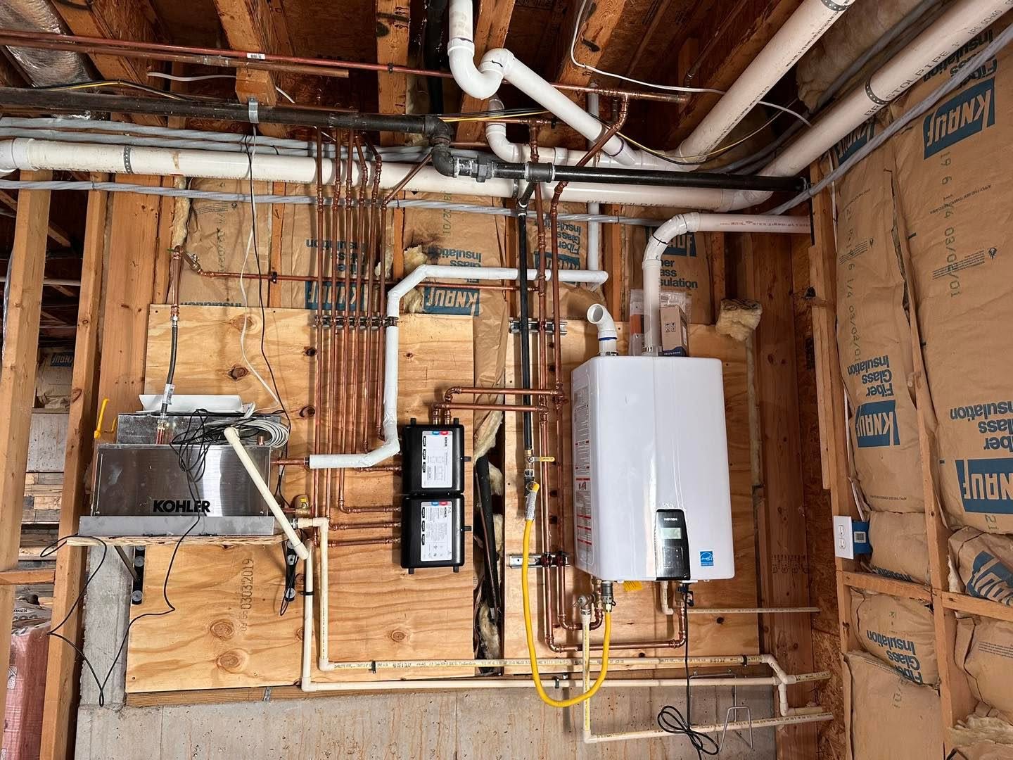 Tankless water heater and plumbing rough-in in a new home