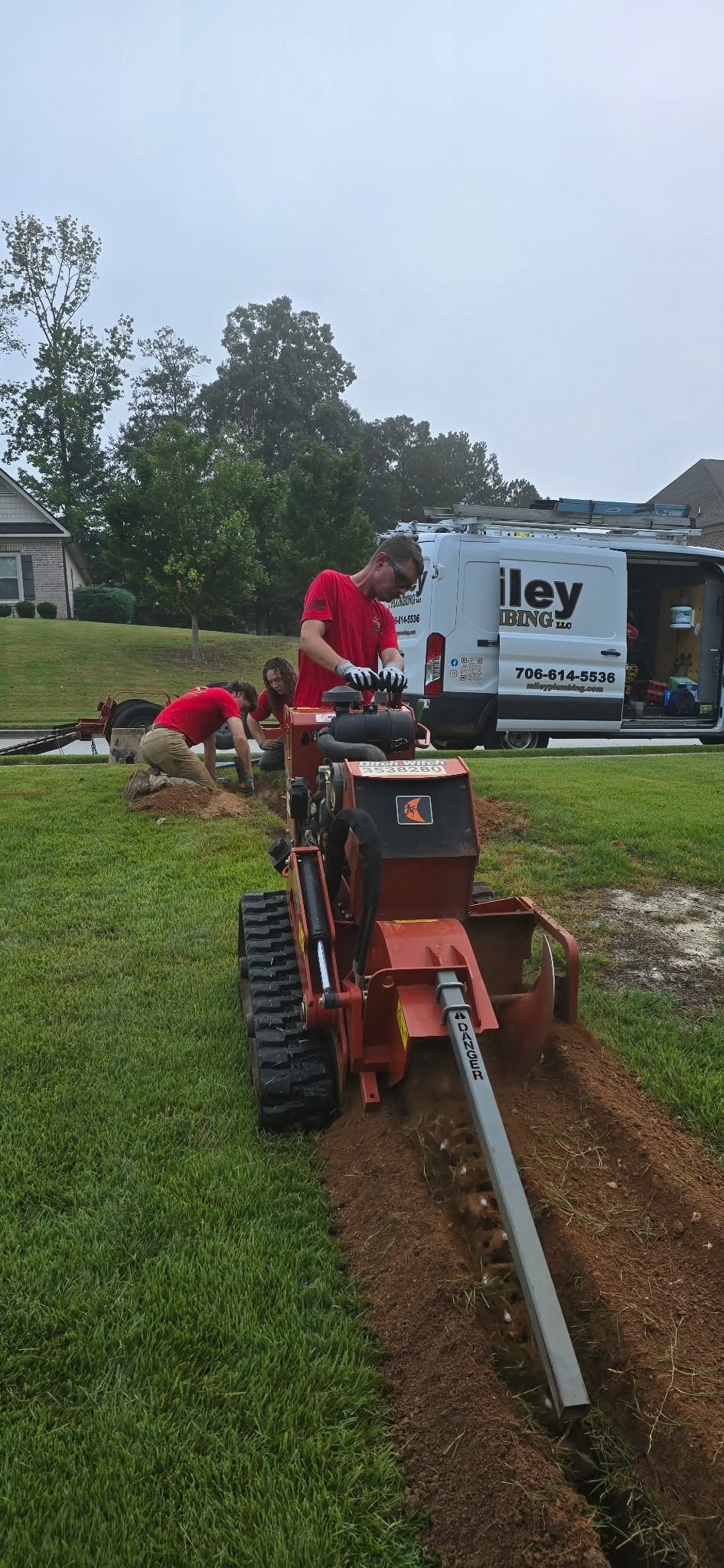Miley Plumbing crew trenching for a new sewer line