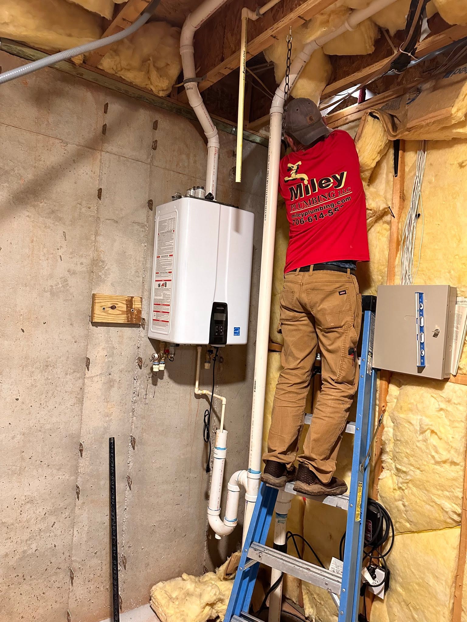 Miley Plumbing plumber installing a tankless water heater