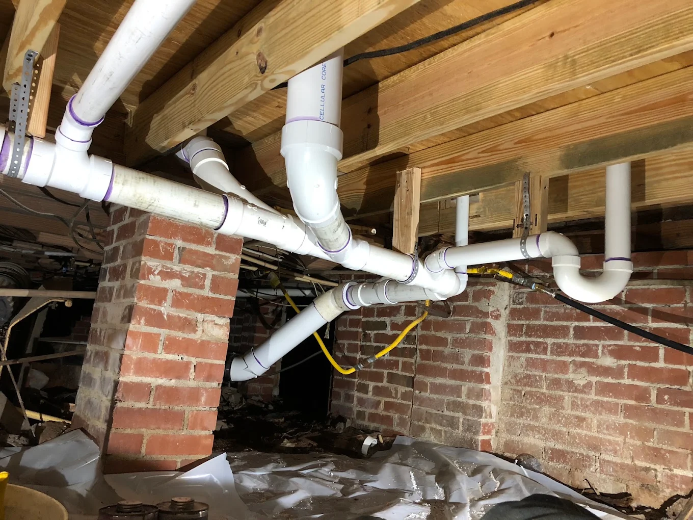 PVC drain lines in a crawl space