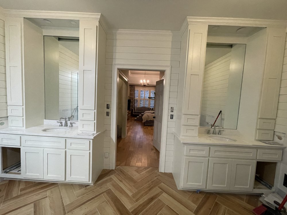 Finished bathroom with double vanities